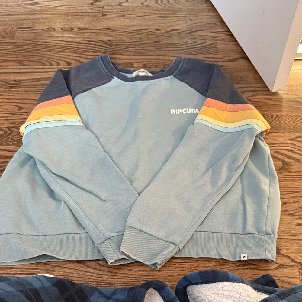 Rip Curl women’s blue and striped crewneck